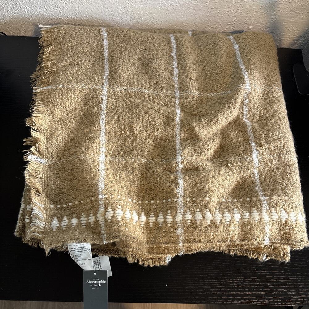 Abercrombie & Fitch throw blanket with a tan and white striped pattern